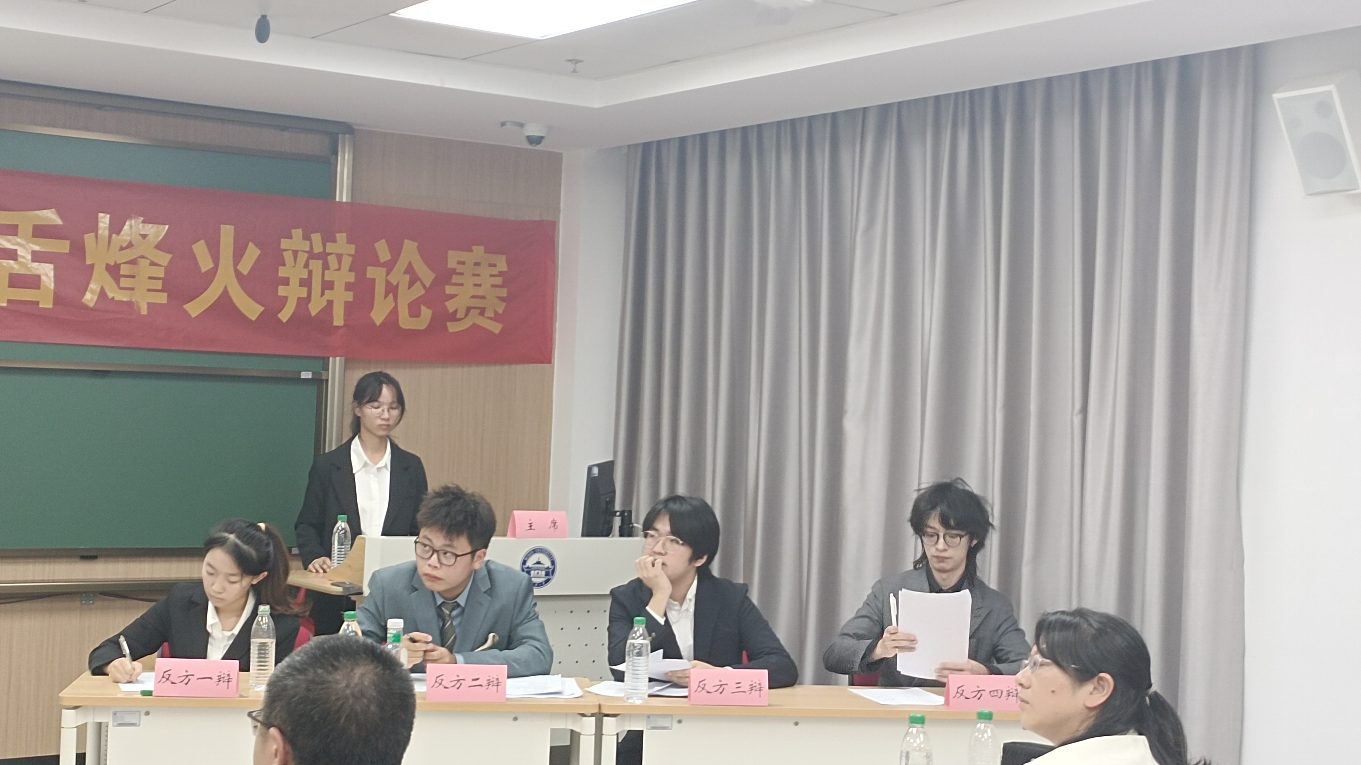 Linyi Jiang with the debate team at Wuhan University